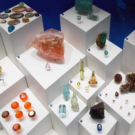 Colorful cut and raw gems and minerals on exhibit at the Academy