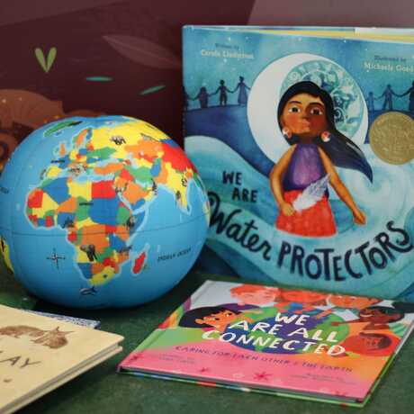 Display of toy globe and children