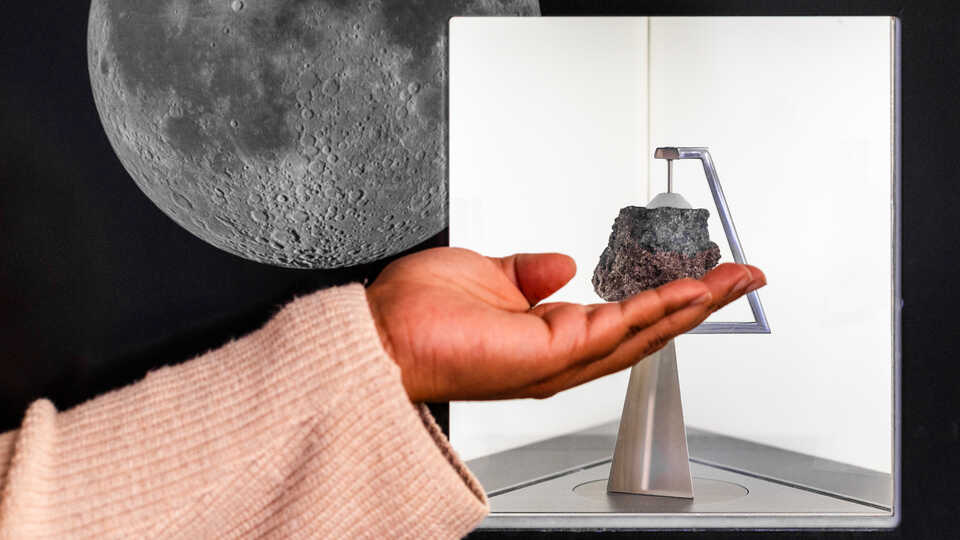 An outstretched hand appears to hold the Academy's Moon rock specimen