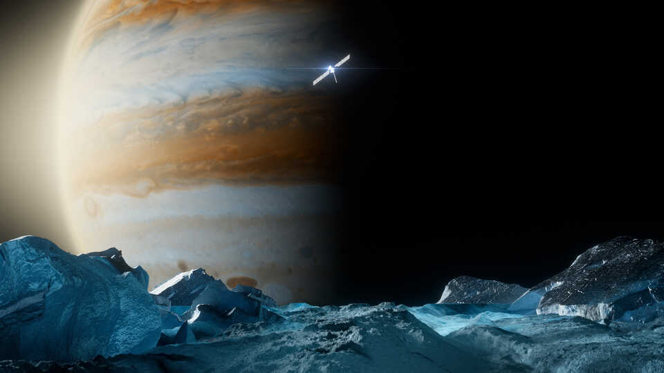 Artist rendering of surface of Jupiter's moon, Europa, with Jupiter looming in the background, and Europa Clipper spacecraft in the middle