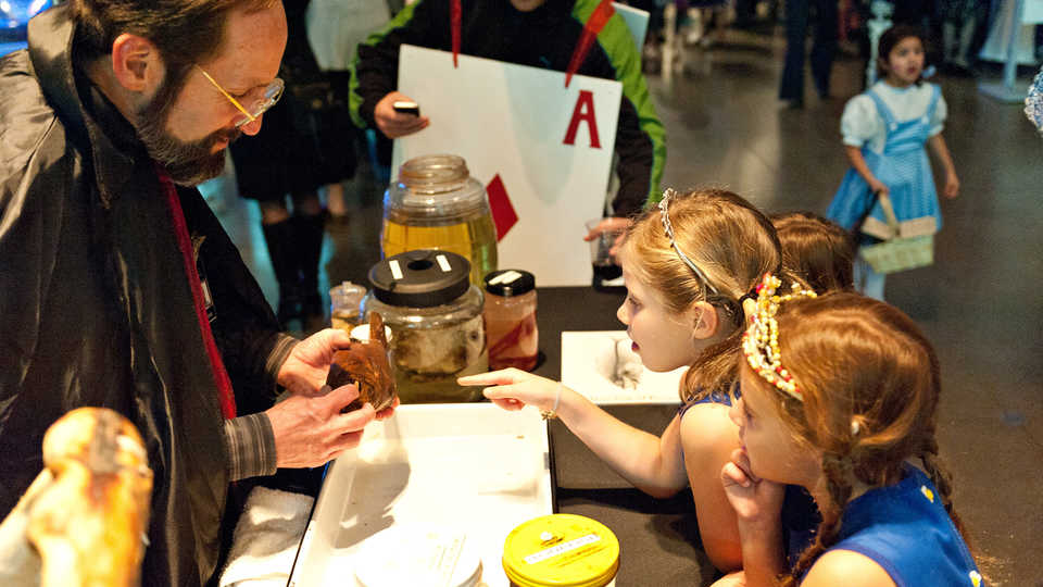 Children in costume with specimens